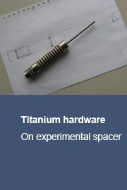 Titanium hardware on experimental spacer